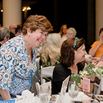 Author and guest eating dinner together.